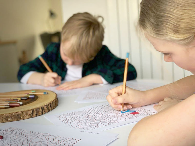Two Children Coloring in patterns made with The Infinite Coloring Book